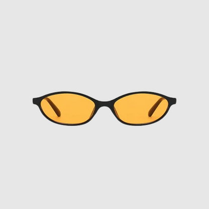 Sunglasses with yellow lenses and black frames on a light gray background