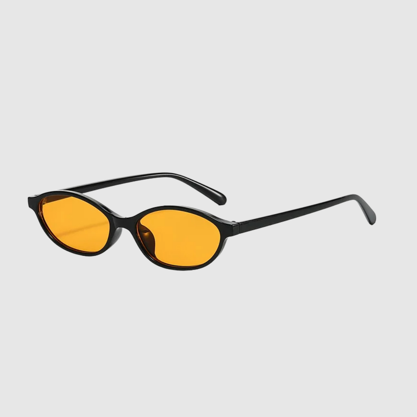 Sunglasses with black frames and yellow lenses on a light gray background
