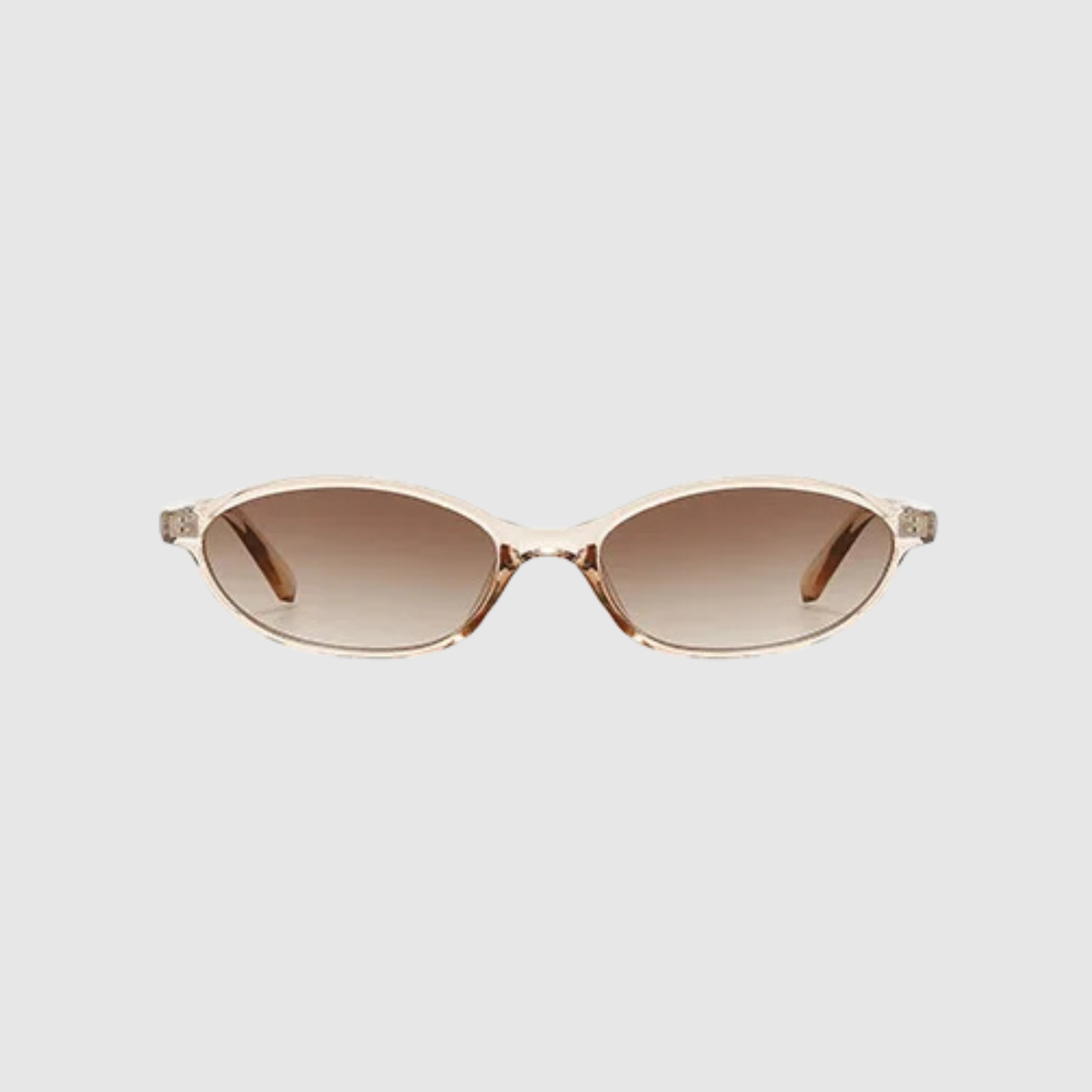 Sunglasses with clear frame and brown gradient lenses on a light gray background