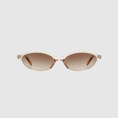 Sunglasses with clear frame and brown gradient lenses on a light gray background